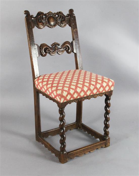 A late 17th century French oak rail back chair,